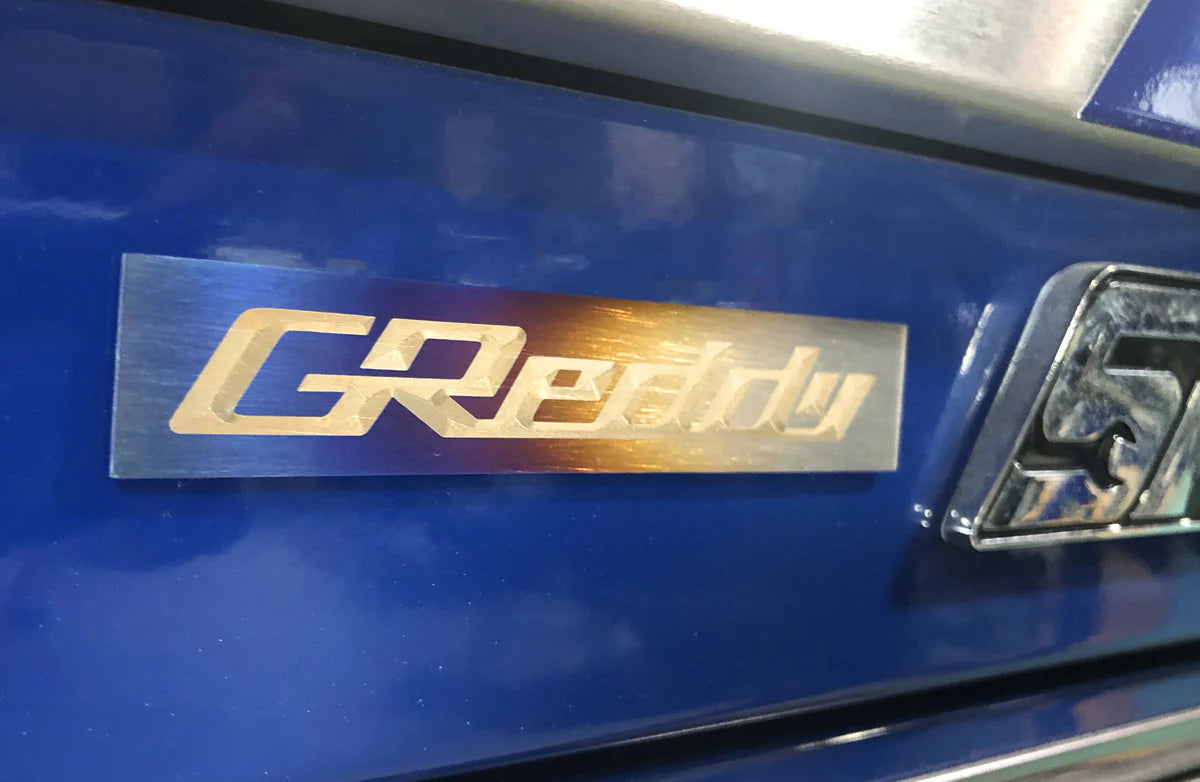 GReddy Performance Parts Optional Titanium GReddy Emblem - (105x20mm)