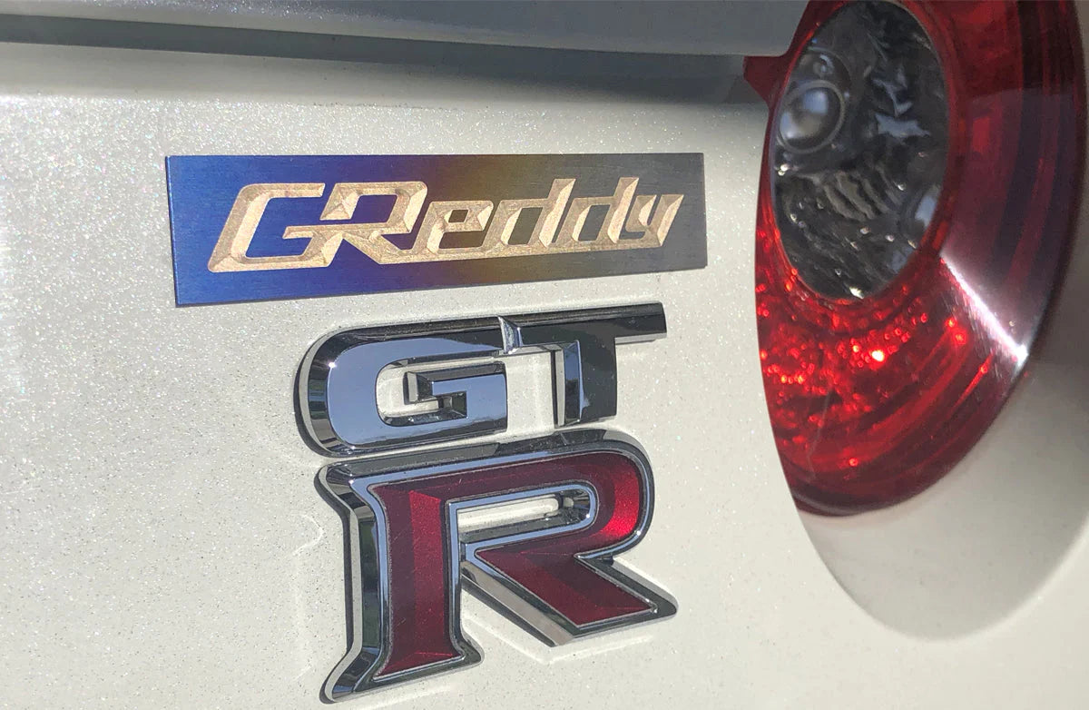 GReddy Performance Parts Optional Titanium GReddy Emblem - (105x20mm)