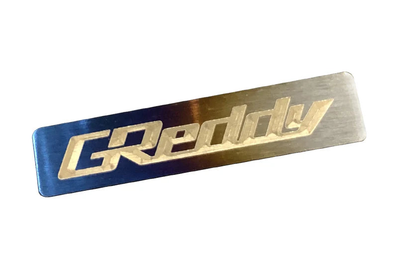 GReddy Performance Parts Titanium GReddy Emblem - (70x15mm)