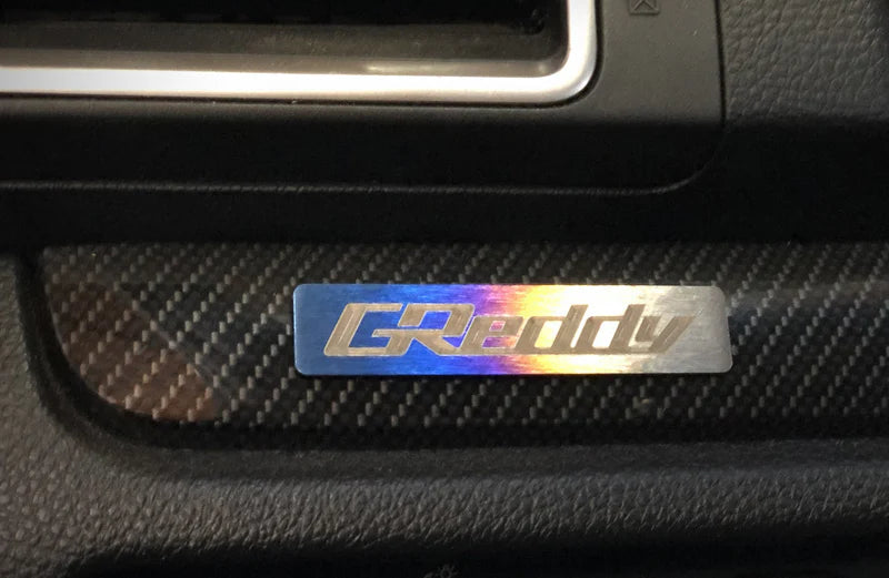 GReddy Performance Parts Titanium GReddy Emblem - (70x15mm)