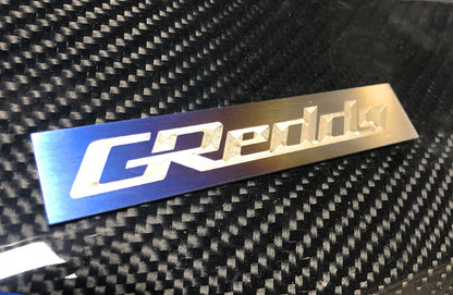 GReddy Performance Parts Optional Titanium GReddy Emblem - (105x20mm)