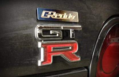 GReddy Performance Parts Titanium GReddy Emblem - (70x15mm)